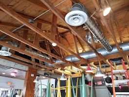 Commercial HVAC ductwork and ventilation system inside a building during scheduled air conditioning maintenance in San Antonio
